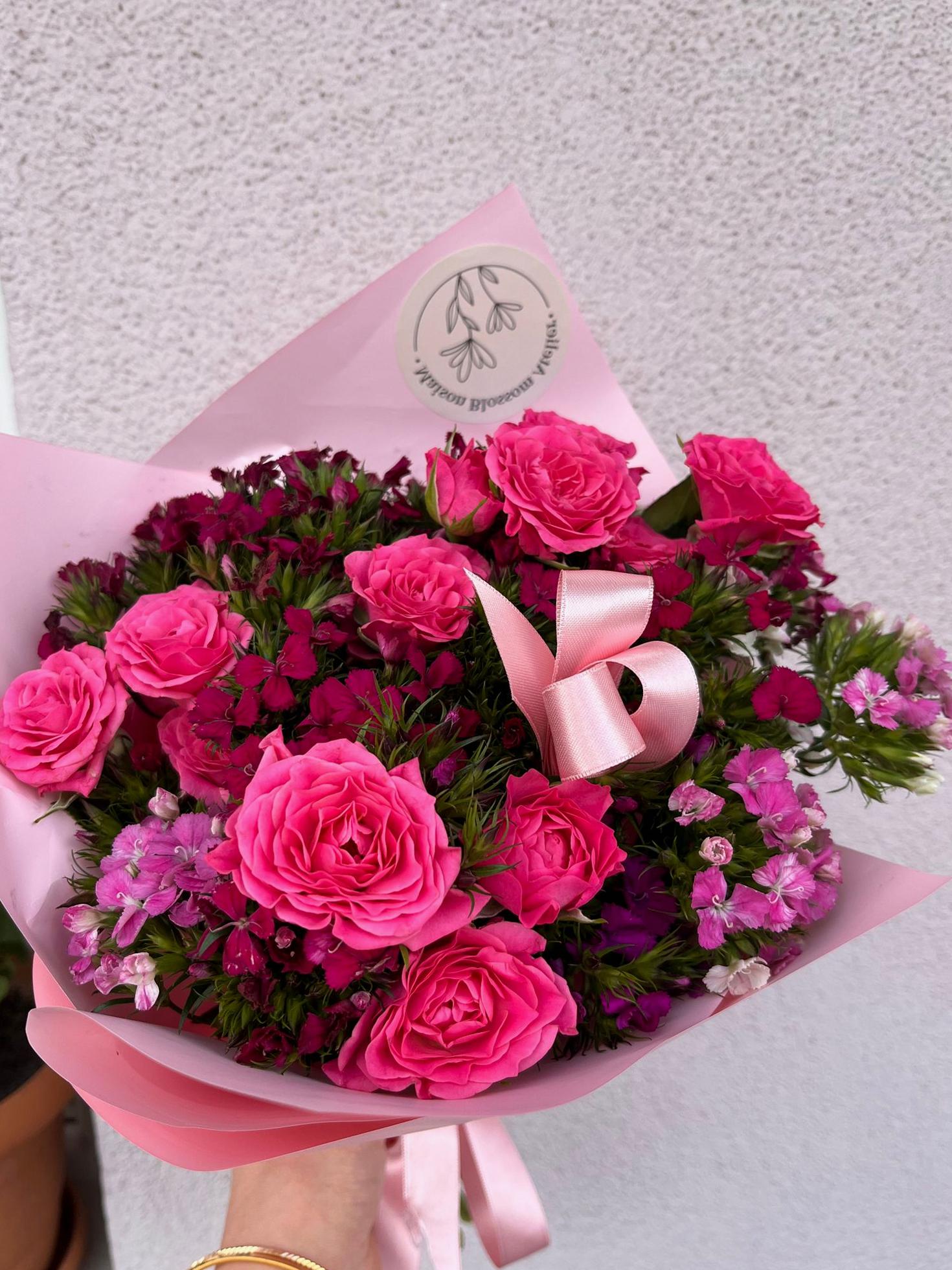 Vivid pink roses and carnations